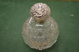 A good cut glass scent bottle with silver mount.