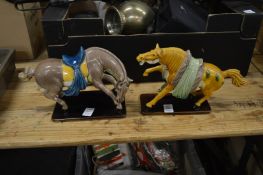 Two Chinese Tang style polychrome decorated pottery horses.