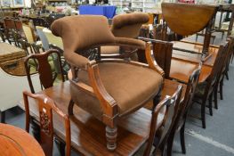 A pair of Victorian walnut framed tub shaped armchairs.