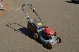 A Honda petrol rotary lawn mower.