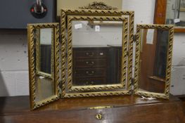 A gilt framed folding dressing table mirror.