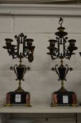 A pair of decorative candelabra.