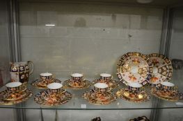 A Royal Crown Derby imari pattern eight place tea service comprising: a pair of cake plates, eight