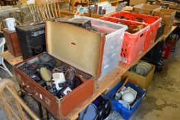 A large quantity of cameras and camera equipment.