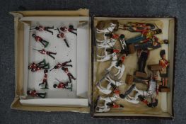 A small group of metal soldiers and other items.