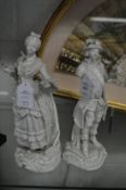 A pair of porcelain figures of a gallant and lady (af).