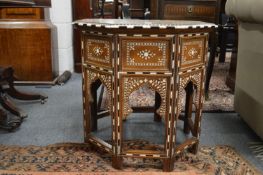 A good bone inlaid octagonal shaped Moorish table with folding base.