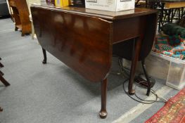 A mahogany drop leaf gateleg dining table.