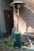 A large floor standing patio gas fired heater.