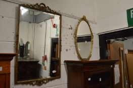 Two decorative gilt framed mirrors.