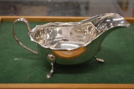 A silver sauce boat.