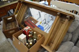 An Arts and Crafts oak overmantle mirror.