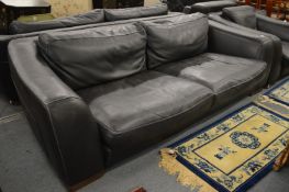 An Incanto black leather large two seater settee.