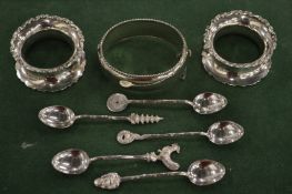 Engraved silver bracelet, pair of silver napkins rings and other Chinese silver spoons.