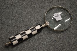 A decorative magnifying glass.