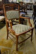 An inlaid satinwood elbow chair.