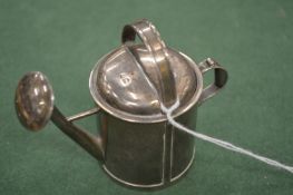 A good silver novelty perfume atomiser modelled a watering can.