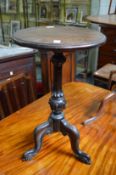 A mahogany tripod table.