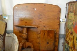 A pine pedestal table.
