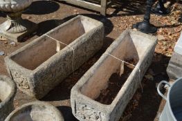 A pair of composite rectangular planters.