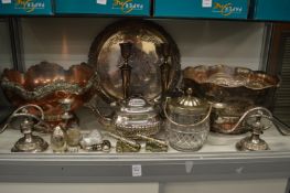 Two large plated punch bowls, a pair of candlesticks and other items.