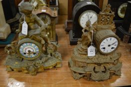 Two decorative ormolu mantel clocks.