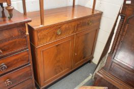 A George III design mahogany sideboard with two drawers over two cupboard doors.
