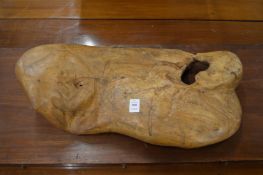 A naturalistically carved piece of wood.