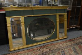 A decorative gilt and green painted overmantle mirror.