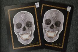 A pair of place mats decorated with Damien Hirst crystal skull, both bear a signature.