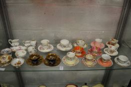 A quantity of porcelain cups and saucers and other decorative china.