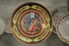 A Vienna dish with decoratively painted central panel.
