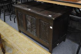 A 18th Century style carved oak coffer.