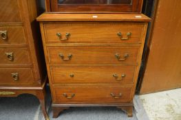 A small mahogany and satinwood banded four drawer chest.