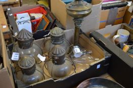 Various lighting including a brass lamp base.