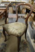 A set of four Victorian mahogany balloon back dining chairs.