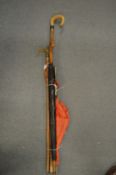 A shepherds crook, an alpine walking stick, umbrella and parasol.