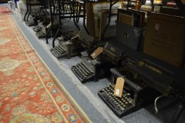 A collection of five Royal early typewriters together with an L C Smith and Brothers typewriter.