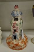 A sponge ware decorated pottery model of a lighthouse.
