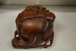 A Chinese carved wood gourd shaped box and cover.