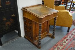 A Victorian walnut davenport.