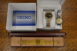 A boxed gentlemen’s Seiko wristwatch, a Limit gentlemen’s dress watch and another gents watch.