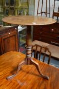 A 19th century mahogany tilt-top tripod table.