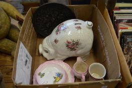 A large pottery piggie bank and other items.