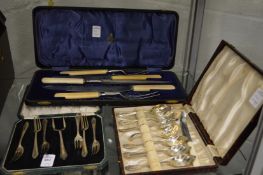 Two cased sets of plated cutlery.