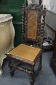 An oak and cane seated hall chair.