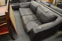An Incanto black leather large two seater settee.
