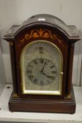 A mahogany cased mantle clock.