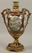 A LARGE CHINESE FAMILLE ROSE PORCELAIN URN WITH ORMOLU MOUNTS, the body painted with panels of