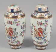 A PAIR OF SAMSON FAMILLE ROSE PORCELAIN VASES AND COVERS, each with central crest and floral